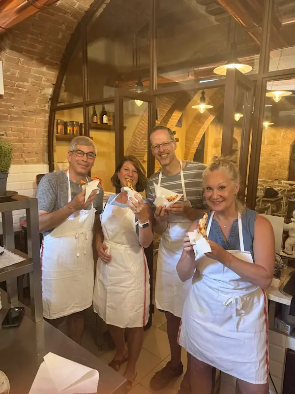 Guests enjoying a hands-on pizza making class in Montepulciano