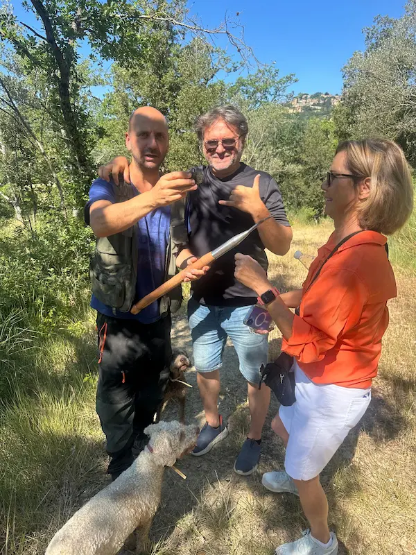 Fabrizio, guests and a local truffle hunter with trained dogs during a private truffle hunt