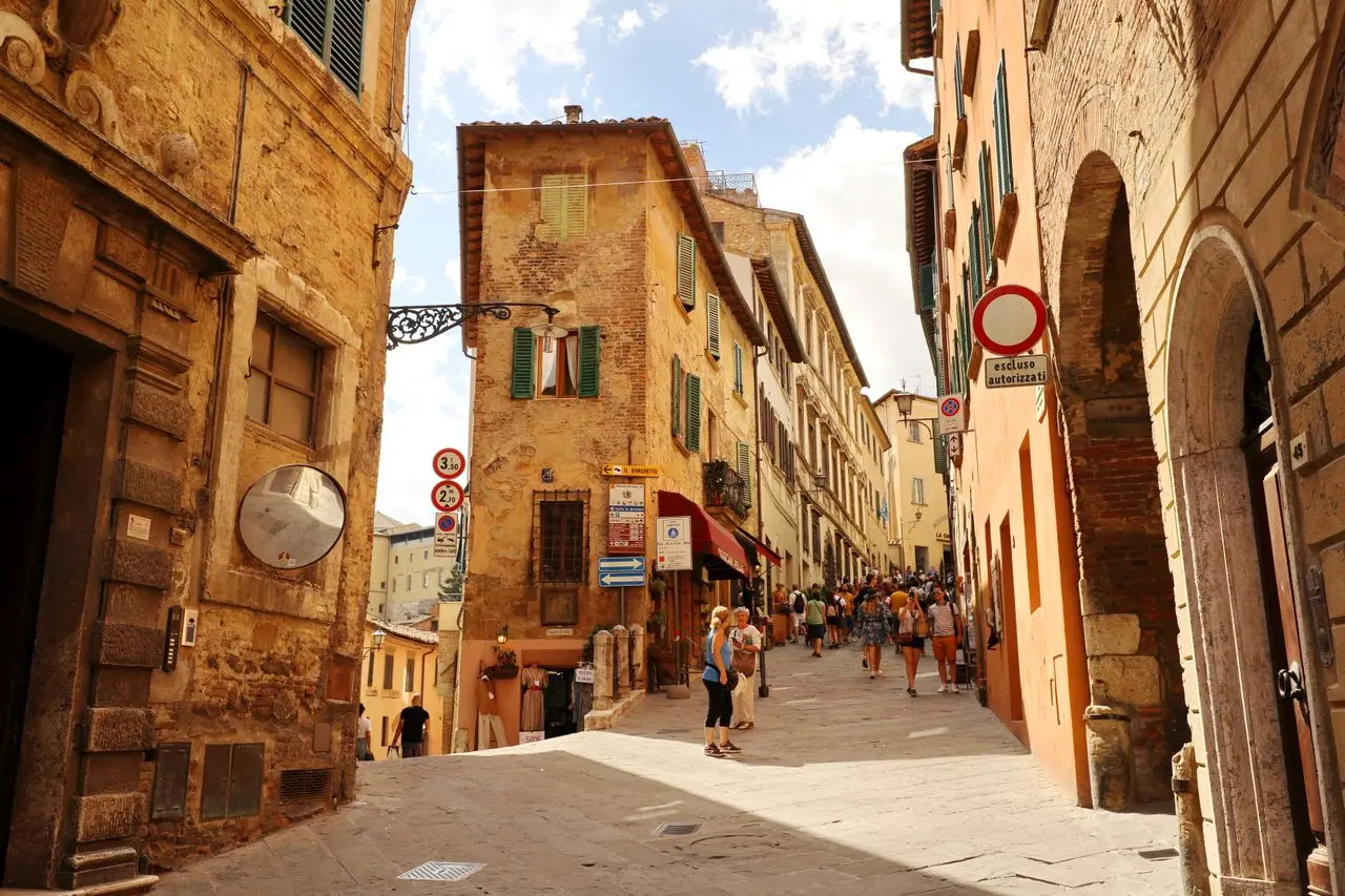 Historic uphill street in Montepulciano during a private walking tour